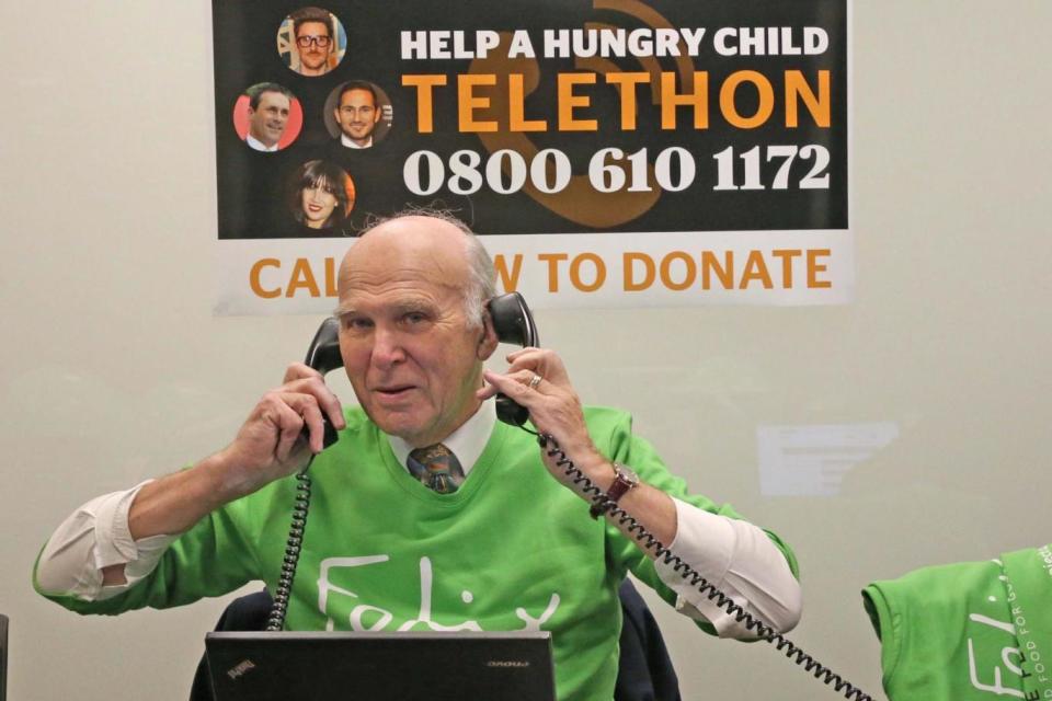 Sir Vince Cable pitching in at the Evening Standard's telethon to raise funds for the Felix Project (NIGEL HOWARD)