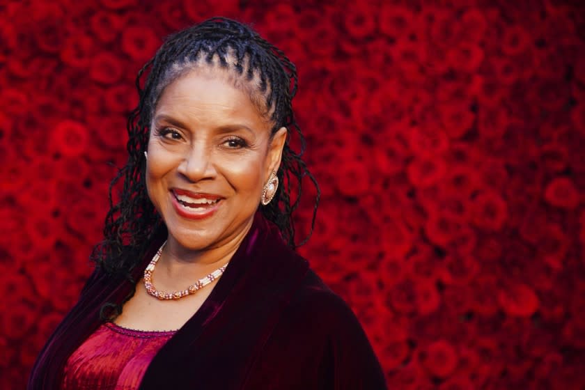 Phylicia Rashad poses for a photo on the red carpet at the grand opening of Tyler Perry Studios in Atlanta.