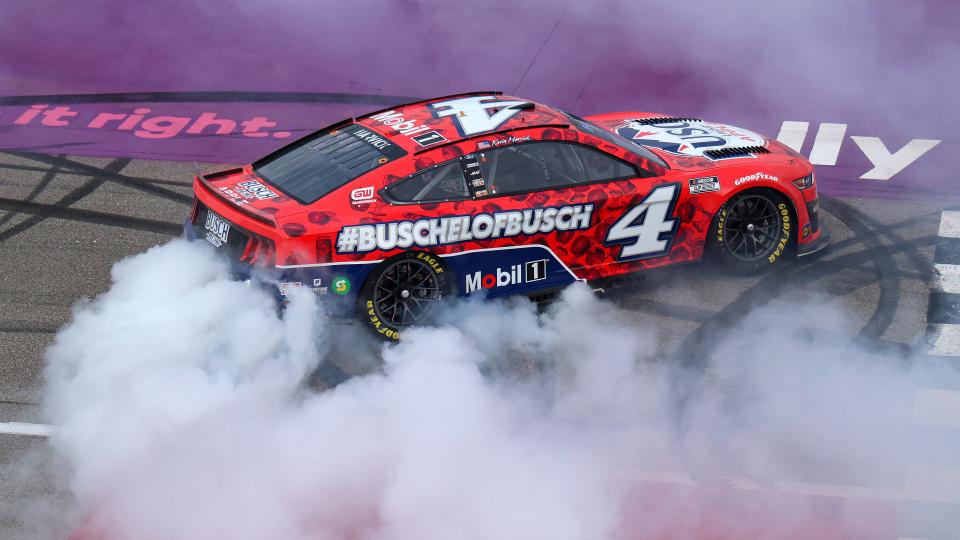 Kevin Harvick, driver of the No. 4 Busch Light Apple #BuschelOfBusch Ford, celebrates with a burnout after winning the NASCAR Cup Series FireKeepers Casino 400 at Michigan International Speedway on Sunday, Aug. 7, 2022, in Brooklyn, Michigan.