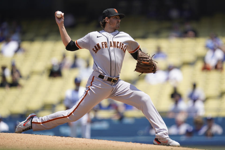 San Francisco Giants starting pitcher Kevin Gausman (34) throws during the first inning of a baseball game against the Los Angeles Dodgers Sunday, May 30, 2021, in Los Angeles. (AP Photo/Ashley Landis)