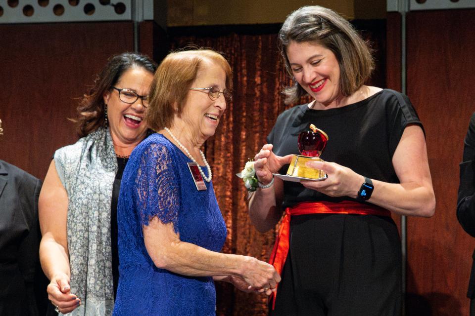 Pat Ozenna-Lemay, a teacher at Cummings Elementary is awarded a Crystal Apple during the 25th annual Crystal Apple Awards at the Salem Convention Center on Wednesday in Salem.