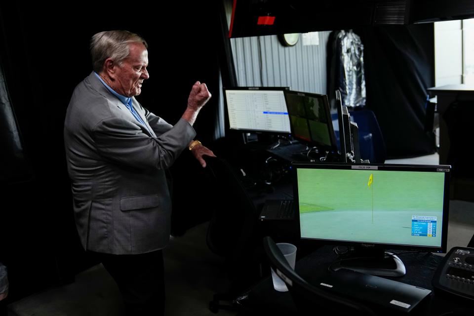 Jack Nicklaus gives a fist pump as he watches the television coverage from the broadcast booth above the 18th green during the second round of the Memorial Tournament.