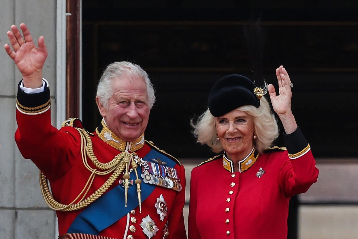 King Charles III and Britain's Queen Camilla wave from the balcony of Buckingham Palace (AFP via Getty Images)