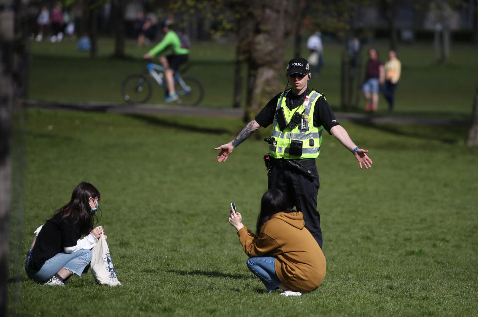 Police officers patrol in the Meadows in Edinburgh as the UK continues in lockdown to help curb the spread of the coronavirus.