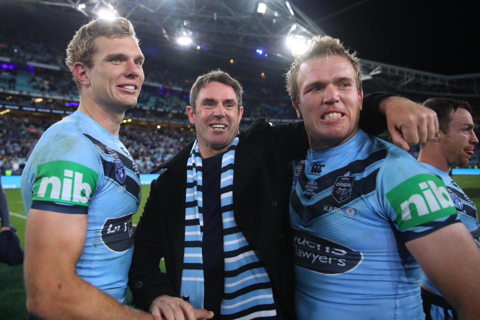 Blues coach Brad Fittler celebrating with Tom Trbojevic and Jake Trbojevic.