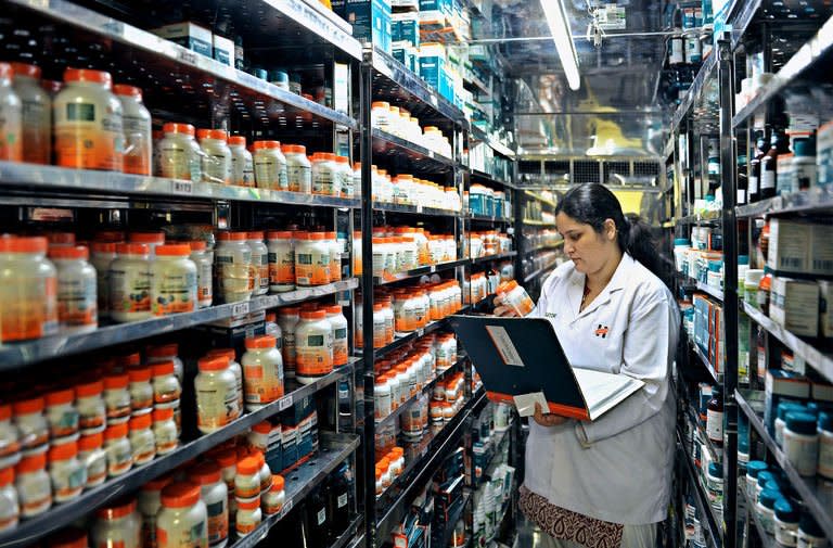 An employee checks on packaged drugs stored in the Stability Chambers of Himalaya Drug Company, in Bangalore, on February 14, 2013. Himalaya's sales have quadrupled in the last five years to reach $220 million in 2012. Its target is a billion dollars in annual revenue in the next four years as it spreads into foreign markets