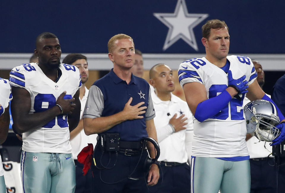 (From left) Former Cowboys wide receiver Dez Bryant, former head coach Jason Garrett and former tight end Jason Witten (82) stand during the national anthem. (AP Photo/Michael Ainsworth)