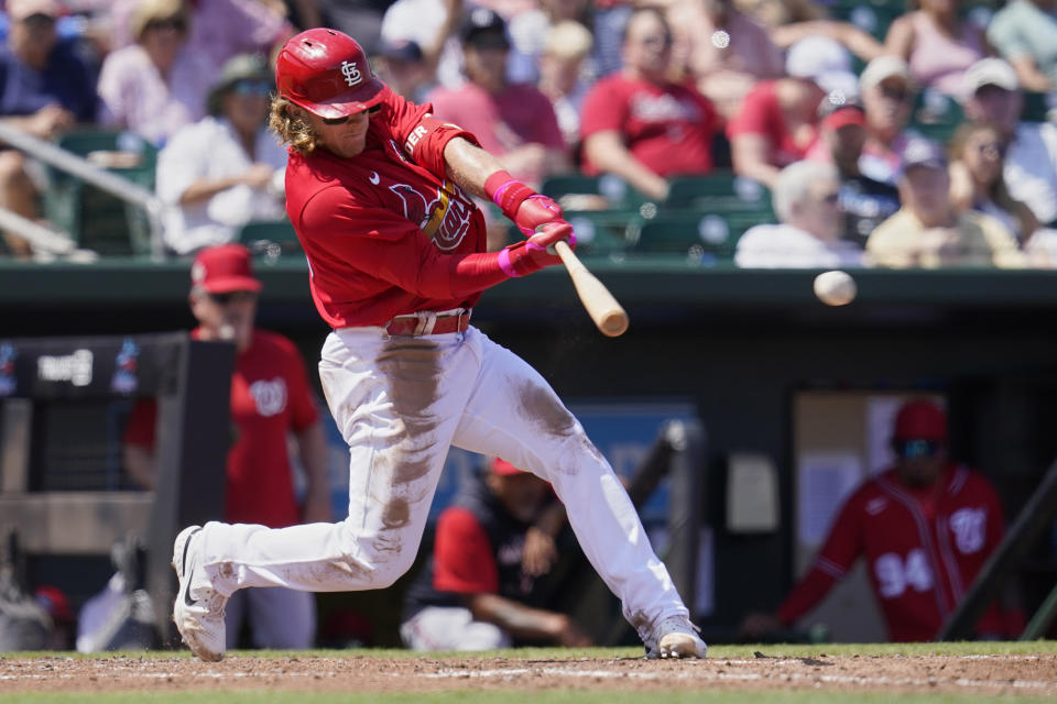 St. Louis Cardinals' Harrison Bader singles in the fifth inning of a spring training baseball game against the Washington Nationals, Friday, March 25, 2022, in Jupiter, Fla. (AP Photo/Sue Ogrocki)