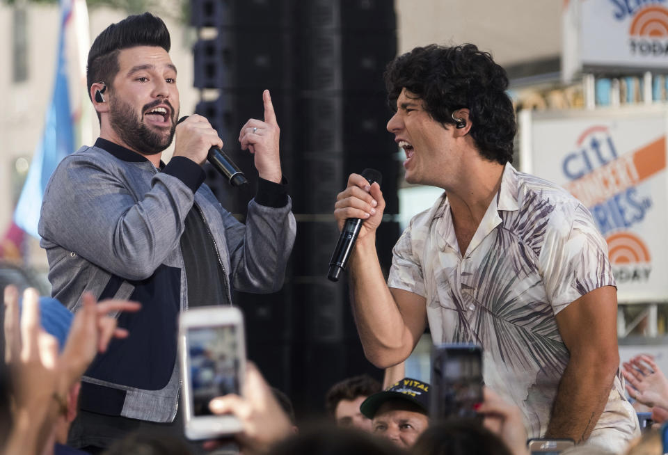 FILE - In this June 25, 2018, file photo, Shay Mooney, left, and Dan Smyers from the band Dan + Shay perform on NBC's "Today" show at Rockefeller Plaza in New York. Christina Aguilera will perform live minutes before the ball drops to usher in 2019 in New York’s Times Square on “Dick Clark’s New Year’s Rockin’ Eve with Ryan Seacrest.” Dick Clark Productions announced on Thursday, Dec. 13, Aguilera will be joined by Bastille, Dan and Shay and New Kids On The Block leading up to the countdown. (Photo by Charles Sykes/Invision/AP, File)