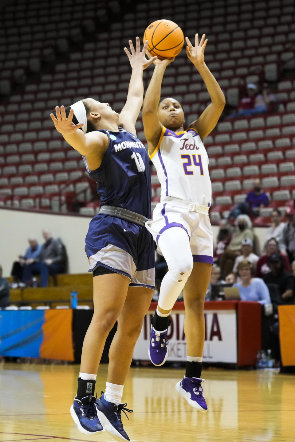 Tennessee Tech guard Jada Guinn (24) shoots against Monmouth forward Lovin Marsicano (11) during the second half of a First Four college basketball game in the NCAA women's basketball tournament in Bloomington, Ind., Thursday, March 16, 2023. Tennessee Tech won 79-69. (AP Photo/AJ Mast)