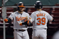 Baltimore Orioles' Renato Nunez (39) celebrates his solo home run with DJ Stewart during the sixth inning of the team's baseball game against the Boston Red Sox, Tuesday, Sept. 22, 2020, in Boston. (AP Photo/Michael Dwyer)