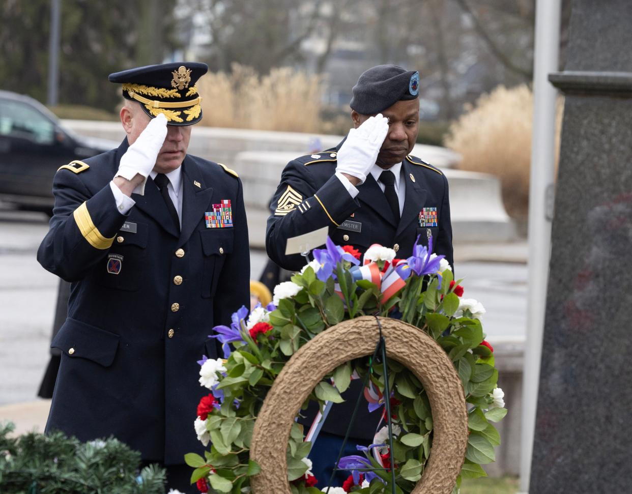 U.S. Army Reserve Maj. Gen. Matthew Baker, left, and Sgt. Maj. James Flemister, both of the 88th Readiness Division, lay a wreath at the McKinley Memorial on behalf of President Joe Biden in Canton Saturday.