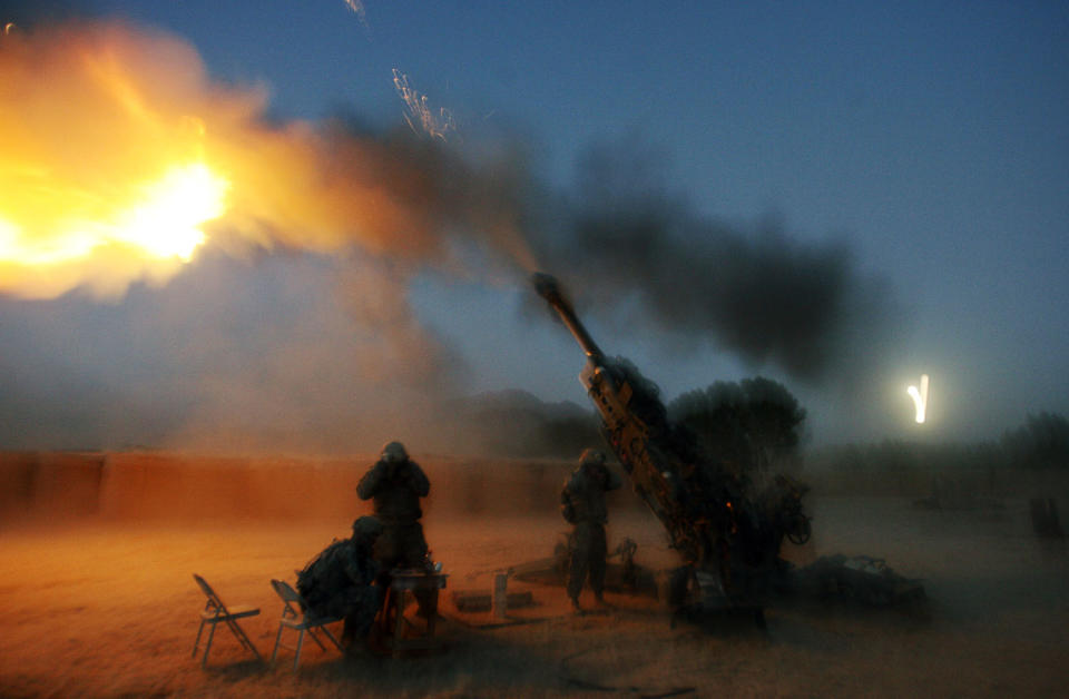 <p>Soldiers from the U.S. Army’s Alpha Battery, 425 Field Artillery, 3rd brigade of 10th Mountain Division based in Fort Drum, New York, fire their 155 mm Howitzer in Cop Cherokee base in Kherwar district in Logar province Oct. 4, 2009. (Photo: Nikola Solic/Reuters) </p>