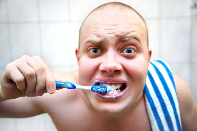 funny man furiously brushing...