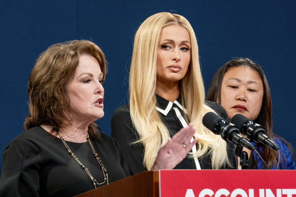State Sen. Shannon Grove, R-Bakersfield, left, discusses her proposed bill calling on more transparency for youth treatment facilities as hotel heiress and media personalty Paris Hilton, center, listens during a news conference in Sacramento, Calif., Monday, April 15, 2024. At right is state Sen. Janet Nguyen, R-Huntington Beach. (AP Photo/Rich Pedroncelli)
