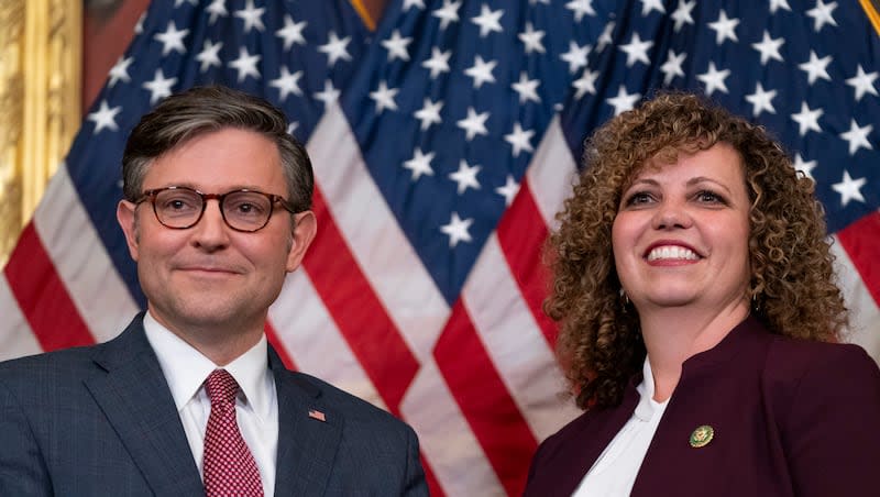 Speaker of the House Mike Johnson, R-La., and newly-appointed Rep. Celeste Maloy, R-Utah, stand for a portrait during a ceremonial swearing-in ceremony, Tuesday, Nov. 28, 2023, on Capitol Hill in Washington.