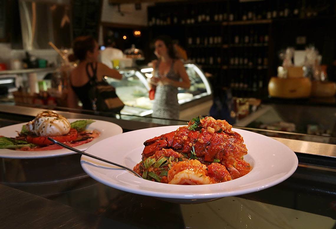 Friday night scene at Perricone’s: spinach linguini with lobster tail and jumbo shrimp, in 2015.