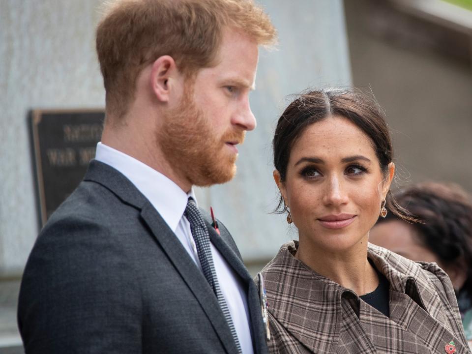 Prince Harry, Duke of Sussex and Meghan, Duchess of Sussex lay ferns and a wreath at the tomb of the Unknown Warrior at the newly unveiled UK war memorial and Pukeahu National War Memorial Park, on October 28, 2018, in Wellington, New Zealand. The Duke and Duchess of Sussex are on their official 16-day Autumn tour visiting cities in Australia, Fiji, Tonga and New Zealand.