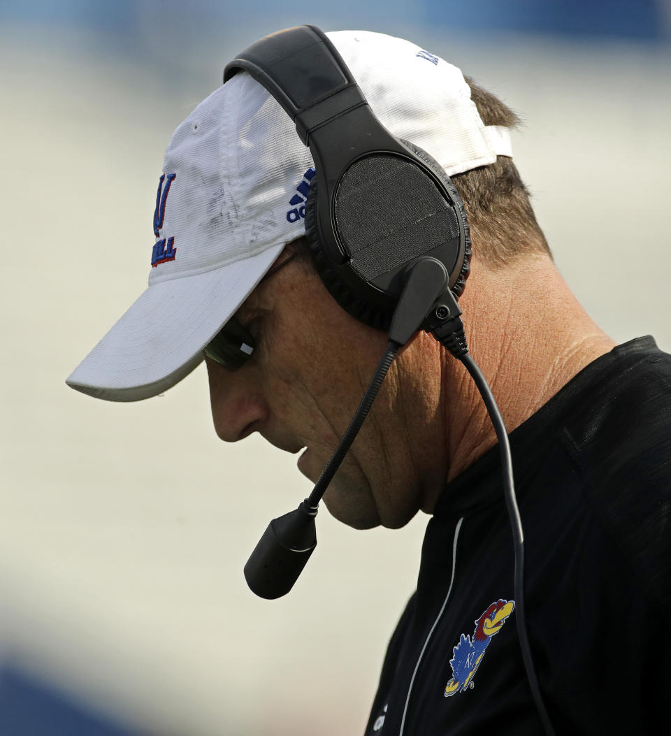 Kansas head coach David Beaty watches during the first half of an NCAA college football game against Central Michigan, Saturday, Sept. 9, 2017, in Lawrence, Kan. (AP Photo/Charlie Riedel)