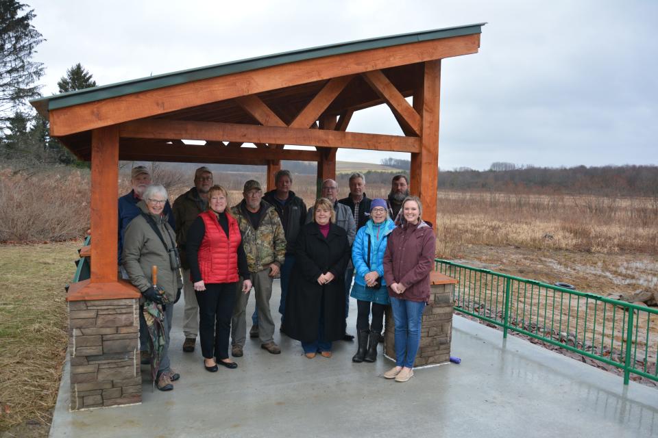 A new handicap accessible recreation area was recently completed along Somerset Lake. Pictured from left are (back row) Jim Moses, Jeff Payne, Bruce Rhodes, Gerald Walker, Don O'Connor, Greg Maust, (front row) Meg Moses, Colleen Dawson, Joe Miller, Pamela Tokar-Ickes, Sandy Cline and Lindsay Pyle.