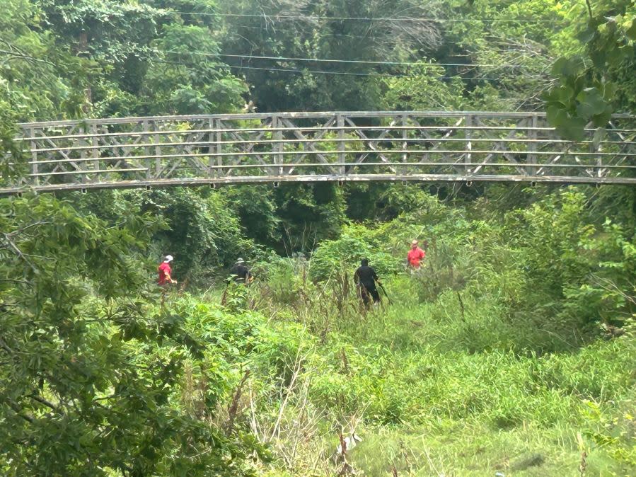 Authorities search the area near Matthew Torres’ apartment, where he was shot and killed on May 17, 2024. (KXAN Photo/Frank Martinez)