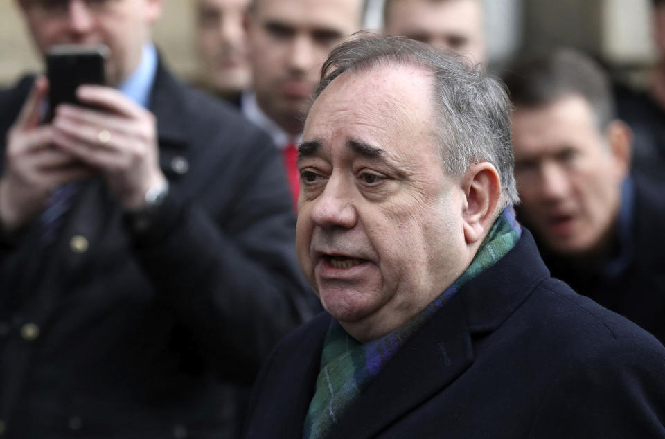 Former Scottish leader Alex Salmond speaks to the media after leaving the High Court in Edinburgh, Thursday Nov. 21, 2019. Salmond, one of the country's best-known politicians, appeared in court faces a total of 14 charges of attempted rape, sexual assault and indecent assault against 10 women. (Andrew Milligan/PA via AP)