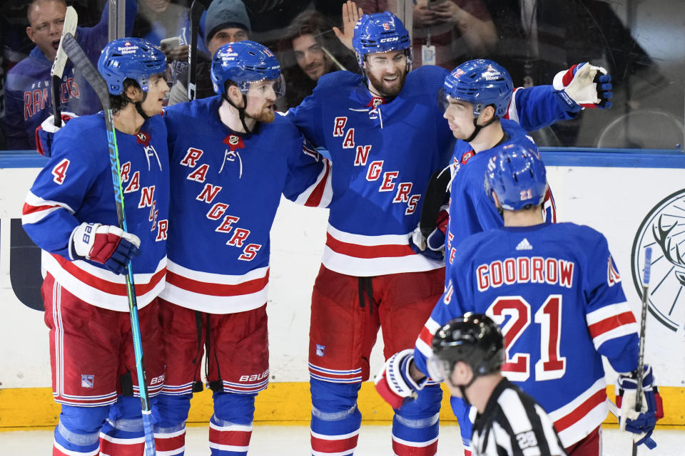 New York Rangers' Ben Harpur, center, celebrates with teammates after scoring a goal during the third period of an NHL hockey game against the Boston Bruins Thursday, Jan. 19, 2023, in New York. The Bruins won 3-1. (AP Photo/Frank Franklin II)