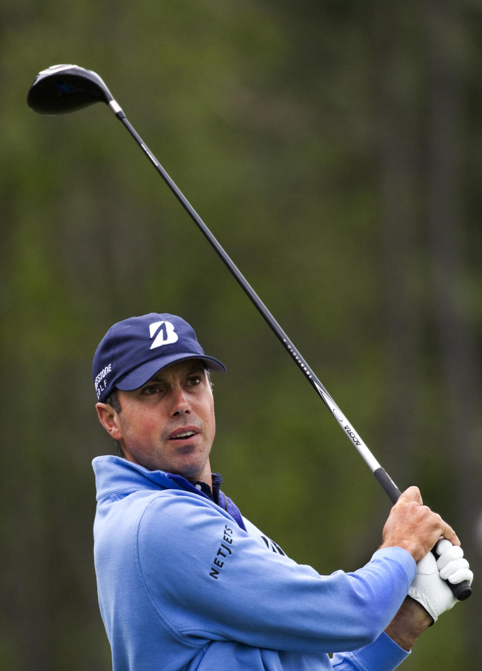 Matt Kuchar hits off the tee on the eighth hole during the third round of the Houston Open golf tournament on Saturday, April 5, 2014, in Humble, Texas. (AP Photo/Patric Schneider)