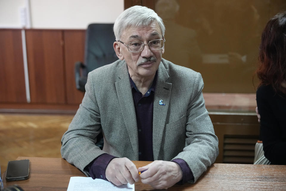 Oleg Orlov, a member of the Board of the International Historical Educational Charitable and Human Rights Society 'Memorial' (International Memorial) sits at a courtroom prior to a session in Moscow, Russia, Wednesday, Oct. 11, 2023. Orlov, the co-chair of the Nobel Peace Prize-winning human rights group Memorial, is on trial on charges of "discrediting" the Russian military in his criticism of Russia's campaign in Ukraine and could face up to five years in prison if convicted. (AP Photo/Alexander Zemlianichenko)