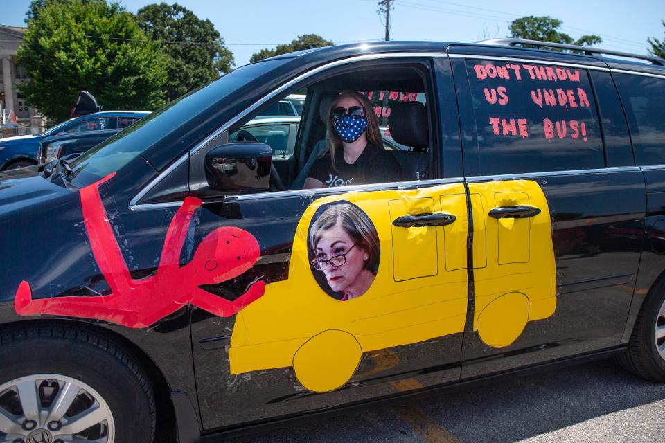 Jenny Turner, Heartland AEA speech therapist, lines up in her car on July 24, 2020 at East High School before joining a motorcade to protest Governor Reynolds' proclamation to allow schools to return to in-person learning in the fall.