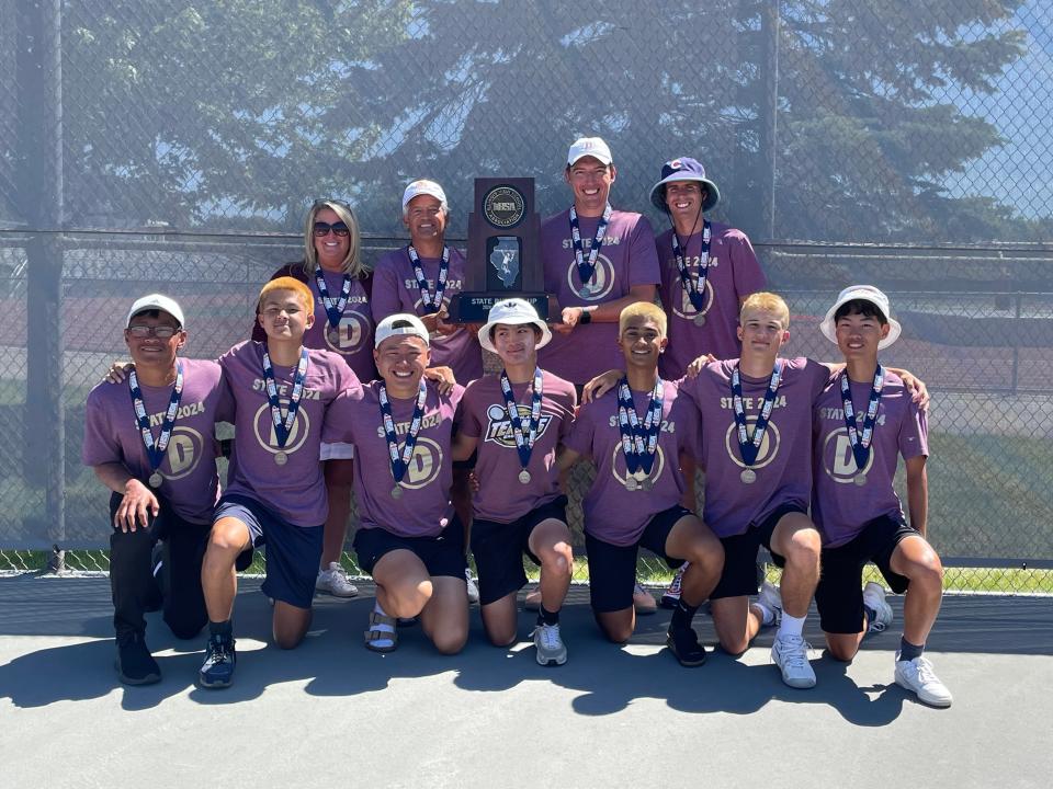 The Dunlap boys tennis team poses with his second-place trophy earned at the 2024 Illinois High School Association Class 1A state finals on May 25, 2024.