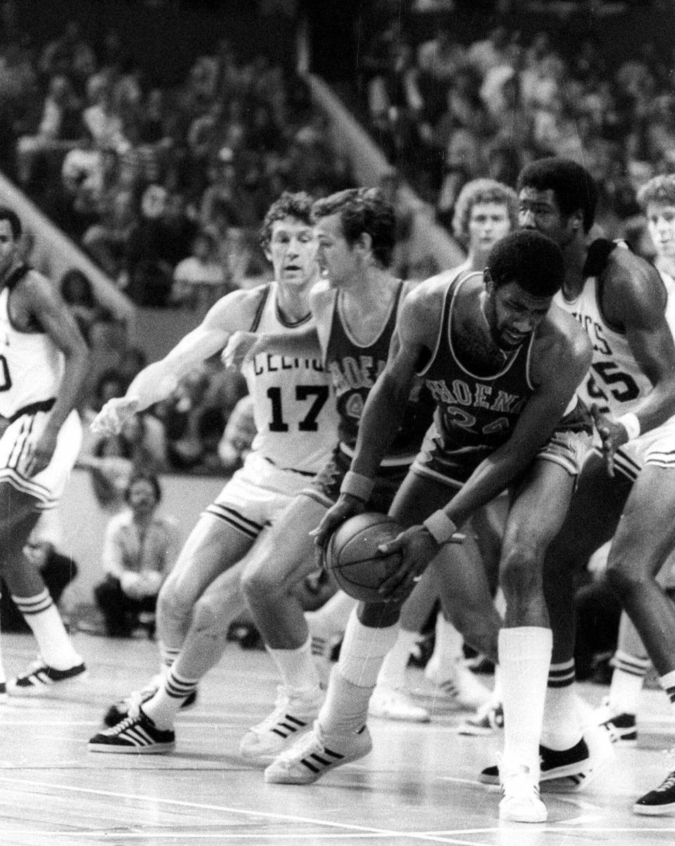 The 1976 NBA Finals, Game 5: Garfield Heard of the Suns holds off the Celtics’ Paul Silas (right) June 4, 1976, in the first overtime that included Boston’s John Havlicek (left, No. 17) and the Suns’ Paul Westphal. Heard’s miraculous buzzer-beating shot in the second of three overtimes tied the game at 112. The Celtics won, 128-126, and two days later wrapped up the title in Phoenix.