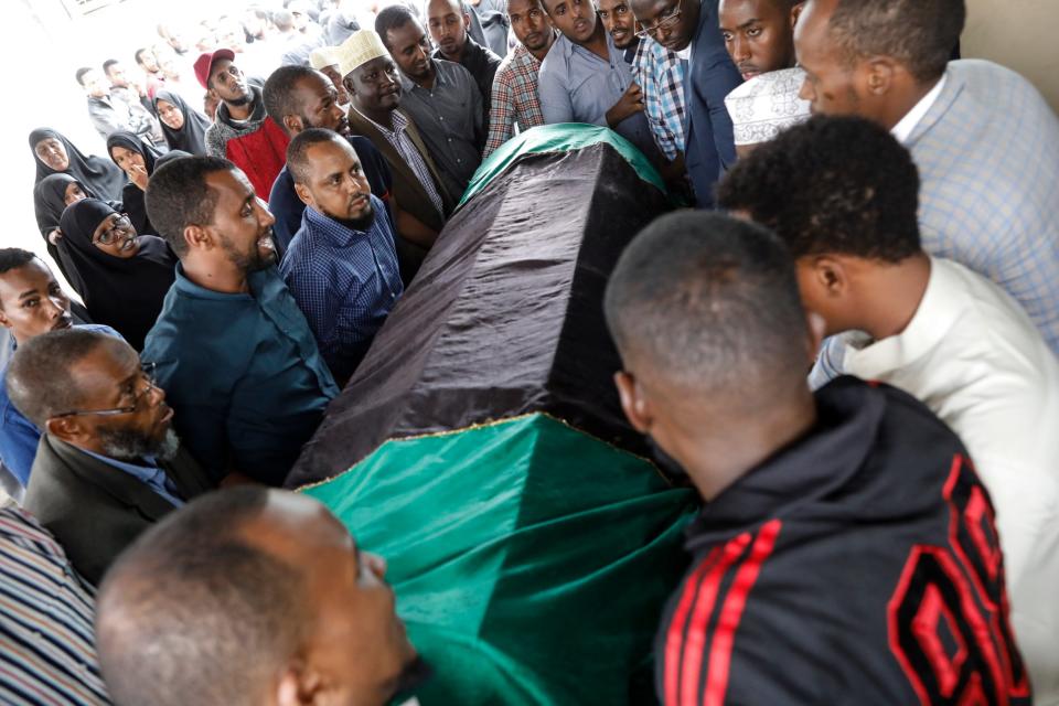 Friends and relatives of slain Muslim men Abdalla Mohammed Dahir carry his casket (EPA)