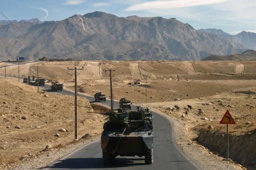 French military vehicles travel in a convoy from Nijrab to Kabul following their departure from France's Camp Nijrab. France ended its combat mission in Afghanistan on Tuesday, withdrawing troops from a strategic province northeast of Kabul as part of a quickened departure from the war-torn country