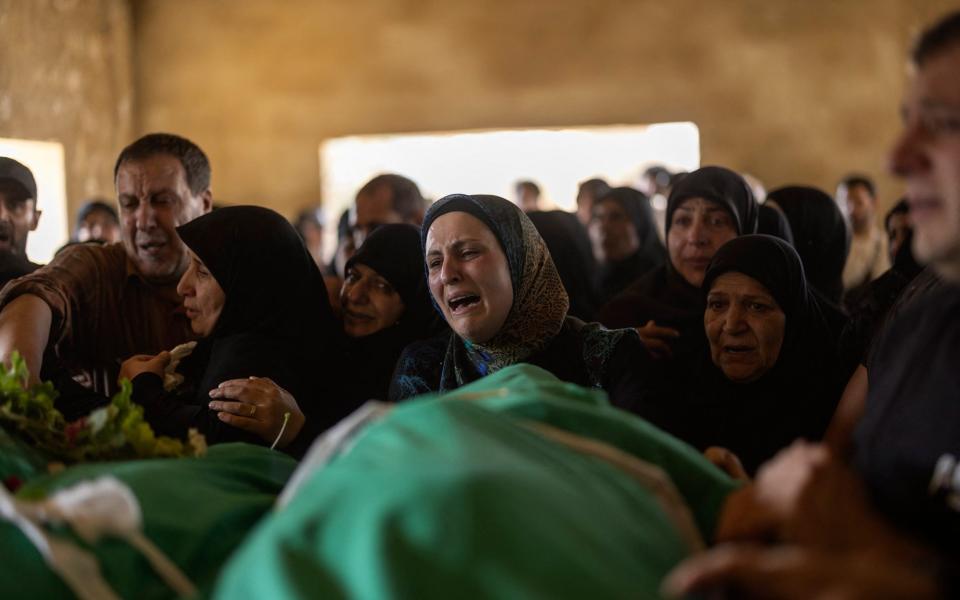 Lebanese mourn during a funeral for five people killed in an Israeli airstrike in the town of Khodor, in Lebanon's eastern Bekaa Valley on Wednesday.