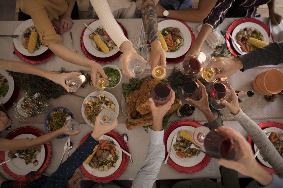 A family toasts over a holiday dinner table