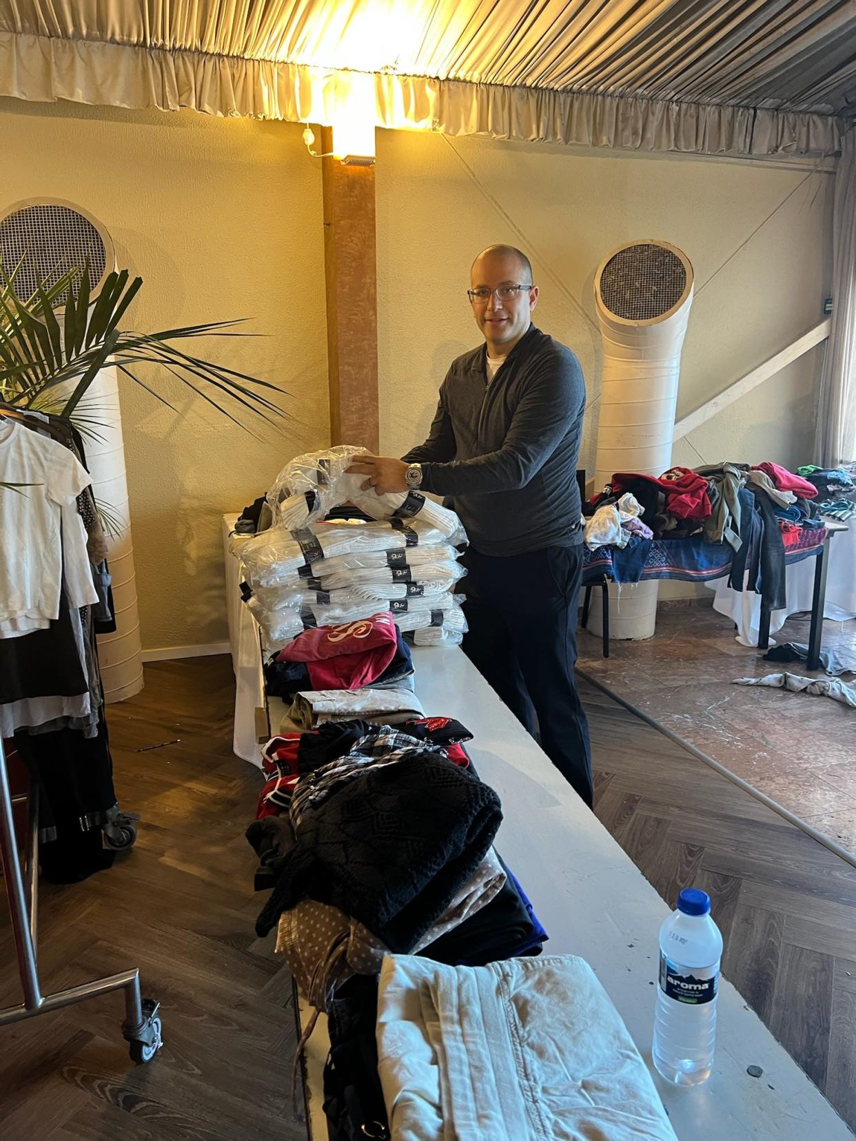 Rabbi Daniel Schwartz of Temple Shir Shalom in Birmingham, Michigan, drops off cases of socks collected by his congregation at a hotel room in Israel during a visit from Jan. 22 to 24. Schwartz said some hotels in Israel are currently home to Israelis who cannot safely return to their homes. These hotels have set up donation rooms where items such as clothes, toys, toiletries can be dropped off and picked up by those staying at the hotel since they are unable return home to pick up items or wash their clothes.