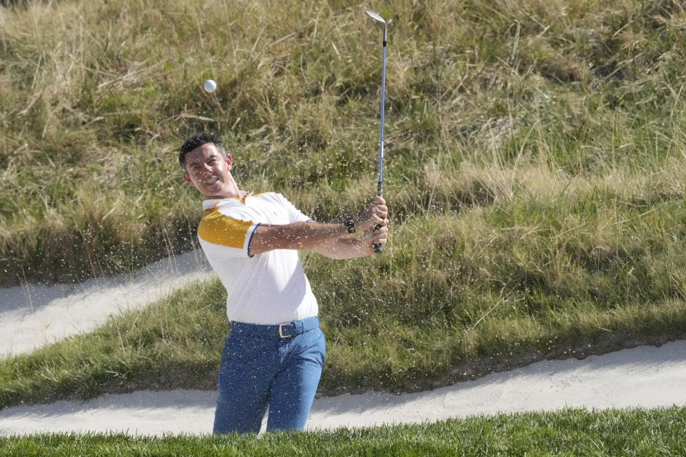 Europe's Rory Mcilroy play out of a bunker on the 16th green during a practice round ahead of the Ryder Cup at the Marco Simone Golf Club in Guidonia Montecelio, Italy, Tuesday, Sept. 26, 2023. The Ryder Cup starts Sept. 29, at the Marco Simone Golf Club. (AP Photo/Andrew Medichini)