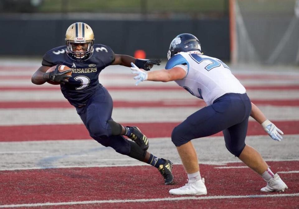 Crusader Richard Cosey carries the ball at the Lindenwood University-Belleville football stadium in 2017, when Althoff Catholic High School was still using the field for home games.