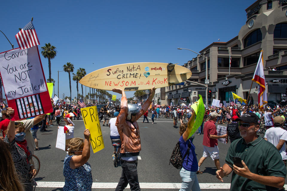 Image: Protest To Reopen California Businesses, Beaches, And Parks Held In Huntington Beach (Apu Gomes / Getty Images)