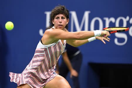 Sep 3, 2018; New York, NY, USA; Carla Suarez Navarro of Spain returns a shot against Maria Sharapova of Russia in a fourth round match on day eight of the 2018 U.S. Open tennis tournament at USTA Billie Jean King National Tennis Center. Mandatory Credit: Danielle Parhizkaran-USA TODAY Sports