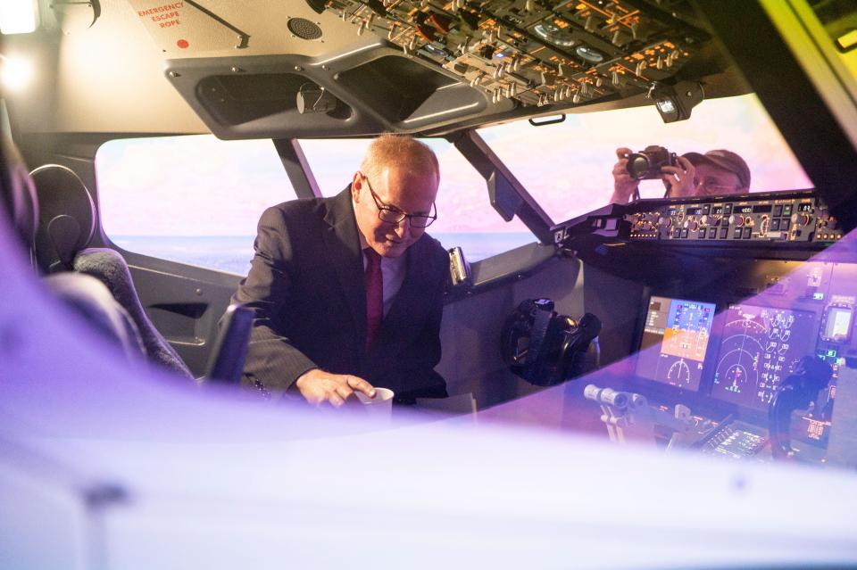 State Rep. Jim Haadsma tours a 737 student flight simulator at Western Michigan University College of Aviation in Battle Creek on Monday, Aug. 21, 2023.