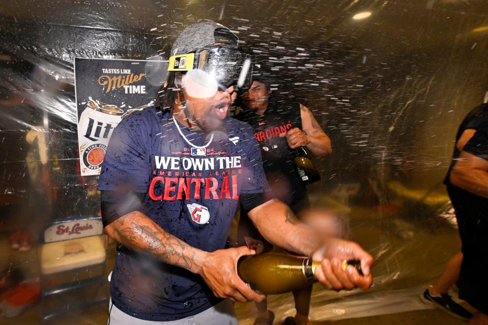 Sep 21, 2024; St. Louis, Missouri, USA; Cleveland Guardians third baseman Jose Ramirez (11) sprays champagne in the locker room with his team after the Guardians clinched the AL central division title after a game against the St. Louis Cardinals at Busch Stadium. Mandatory Credit: Jeff Curry-Imagn Images