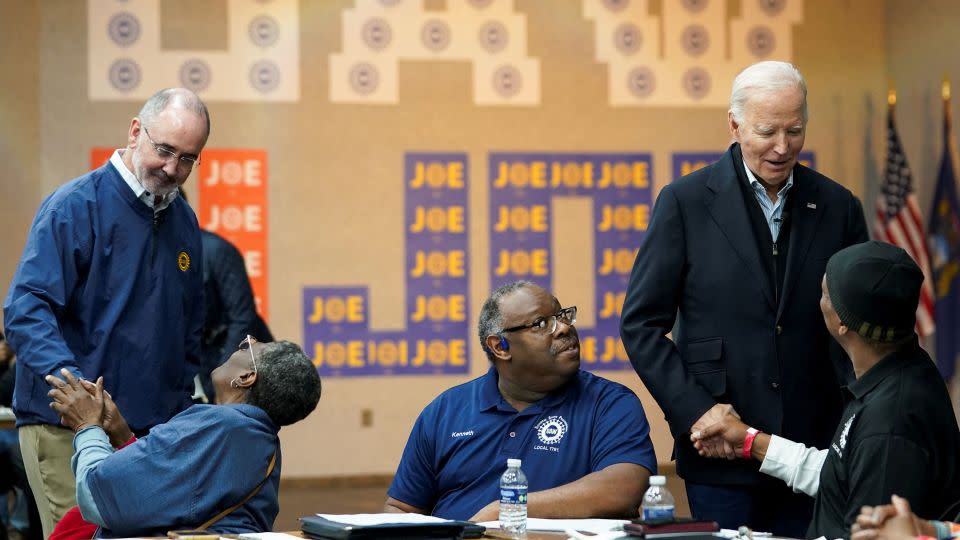 Biden and United Auto Workers chief Shawn Fain, left, meet with autoworkers in Warren, Michigan, on February 1, 2024. - Kevin Lamarque/Reuters