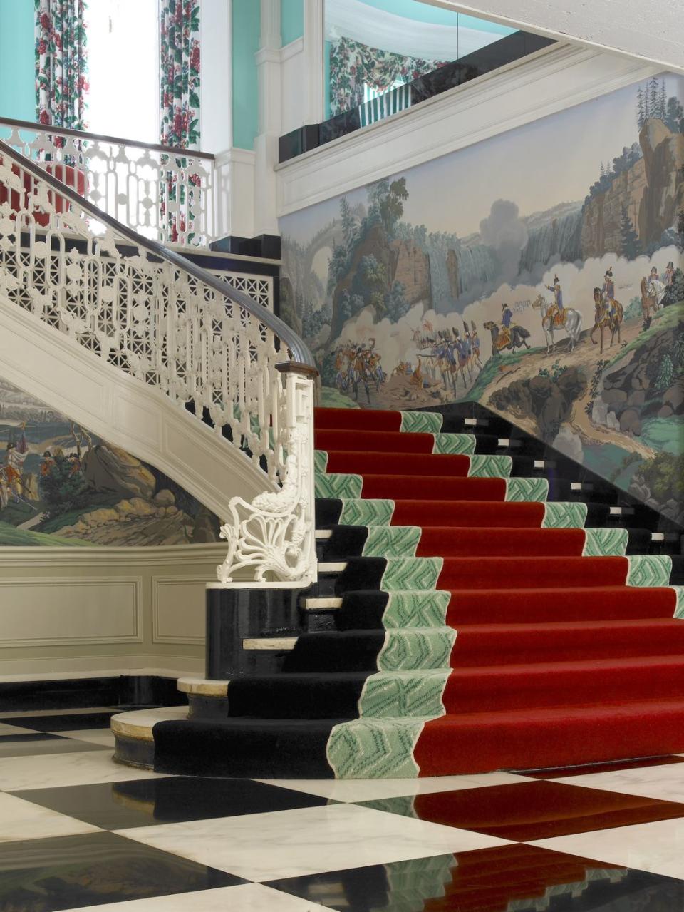a staircase leading up to a painting the greenbrier