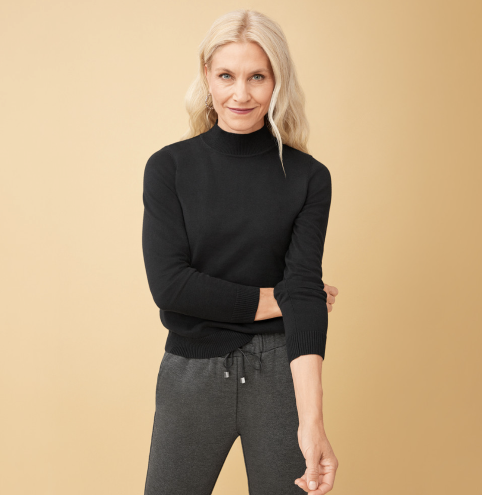 blonde model wearing black Mock Neck Pullover Sweater (Photo via Northern Reflections)