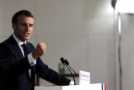 French President Emmanuel Macron speaks during a media conference at an EU summit in Brussels, Friday, Oct. 18, 2019. After agreeing on terms for a new Brexit deal, European Union leaders are meeting again to discuss other thorny issues including the bloc's budget and climate change. (AP Photo/Frank Augstein)