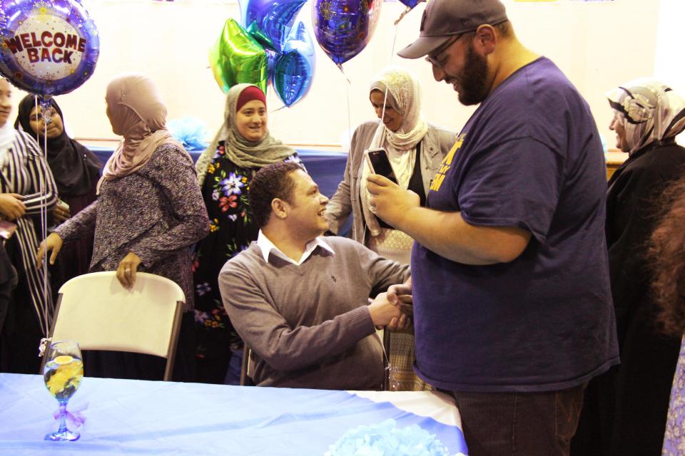 Ahmed Abdelbasit spent his first moments of freedom with his family, friends and students at the high school where he taught, Rising Star Academy. (Photo: Rowaida Abdelaziz/HuffPost)