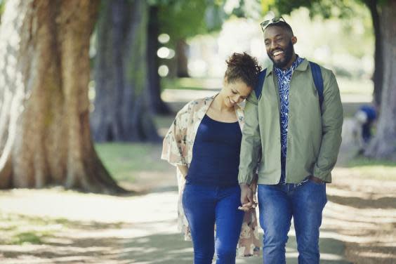 Couple walking in the park (iStock)