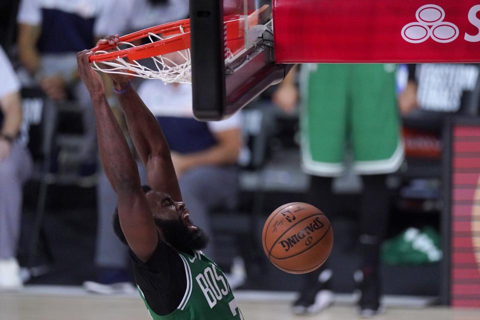 Boston Celtics' Jaylen Brown, celebrates dunking against the Miami Heat during the second half of an NBA conference final playoff basketball game, Saturday, Sept. 19, 2020, in Lake Buena Vista, Fla. (AP Photo/Mark J. Terrill)